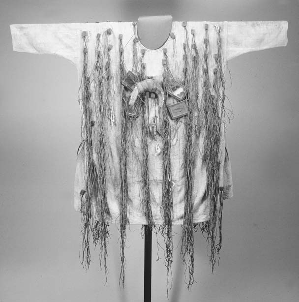 Mande hunters’ association ceremony with decorated hunting shirts, calabash harp, and ritual procession